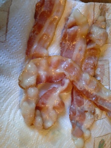 Partially cooked bacon
